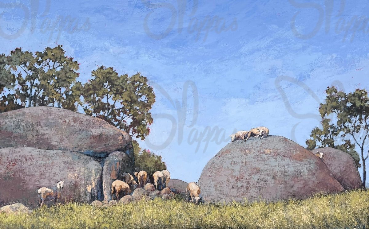 A large painting of granite boulders, with sheep resting on the top.  